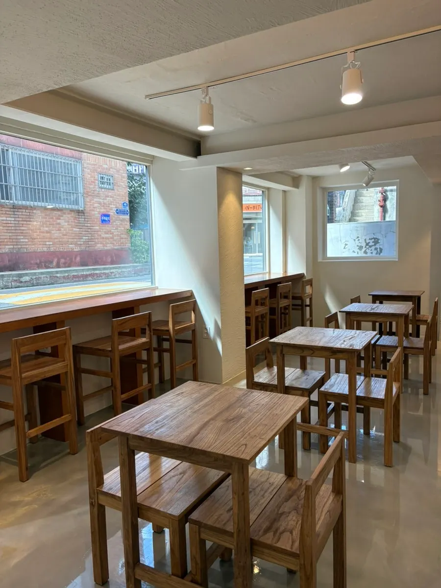 Café entrance down through the open door on the building's right side