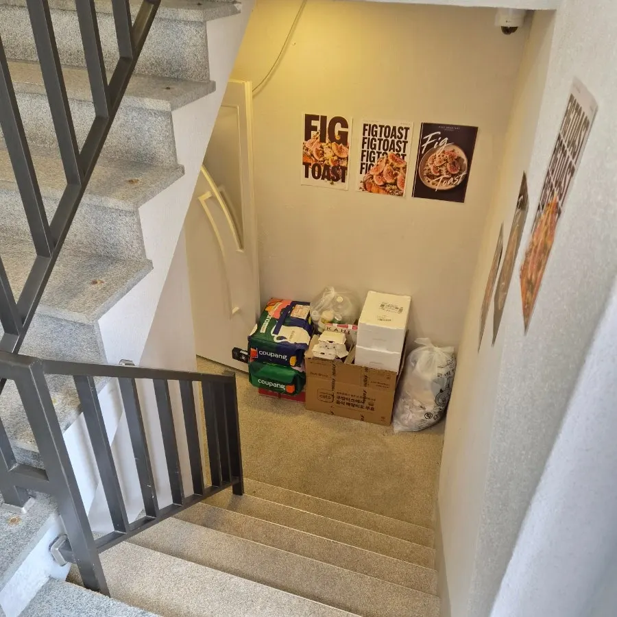 Semi-basement entrance reached by going down half a flight of stairs