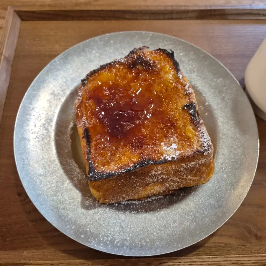 Aged French toast served with the drink