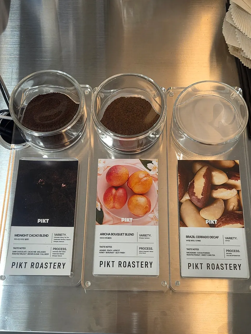 Signage listing bean types and flavor notes