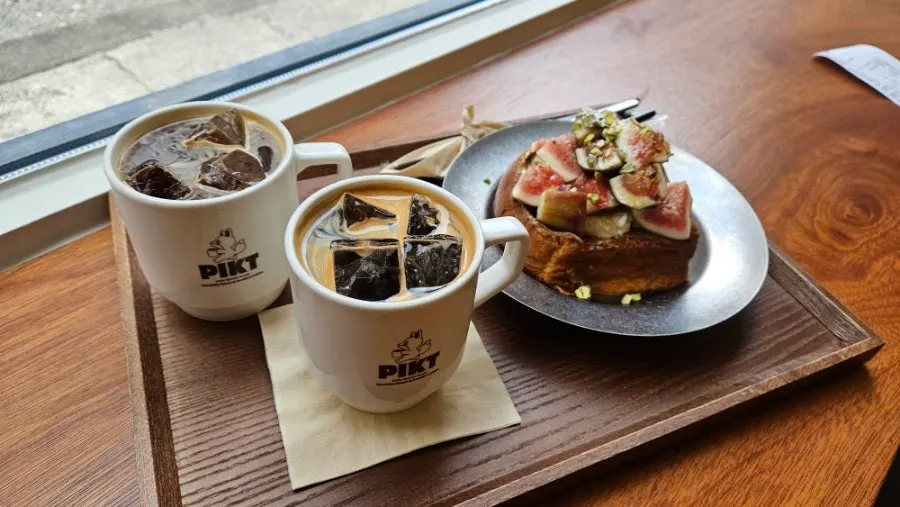 A plate of French toast topped with figs