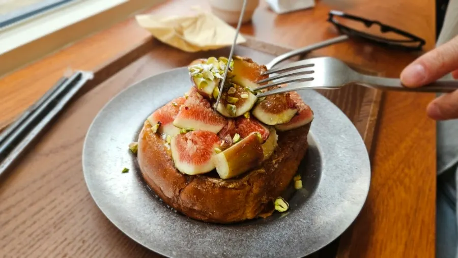 A forkful of fig French toast cut off