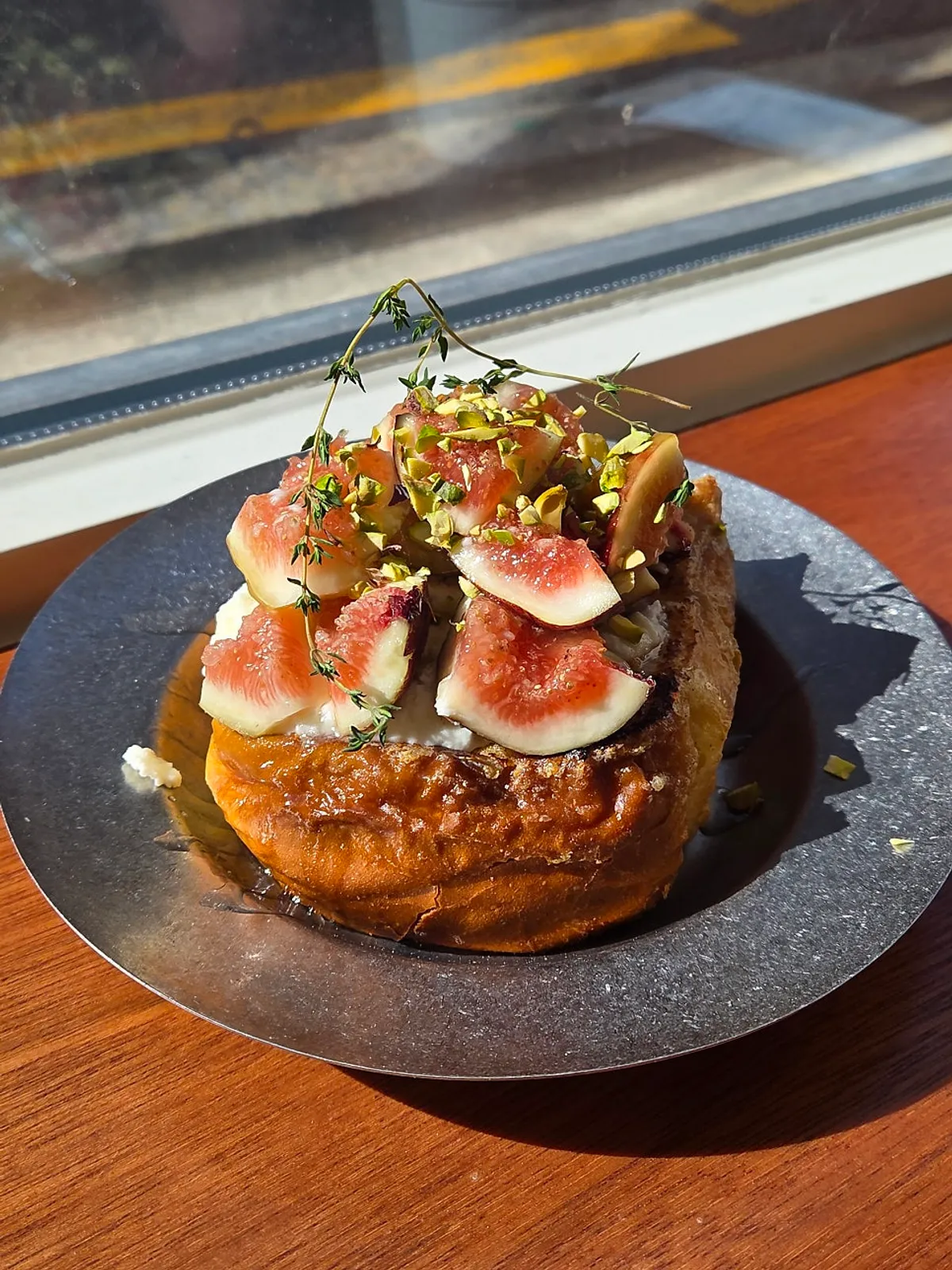 Fig French toast topped with pistachio cream and crushed pistachios
