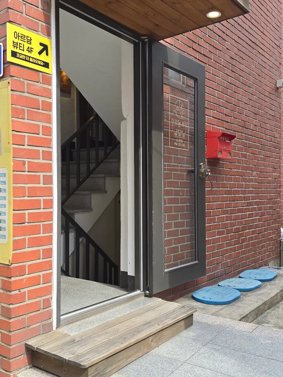 Café entrance with a poster and convex mirror