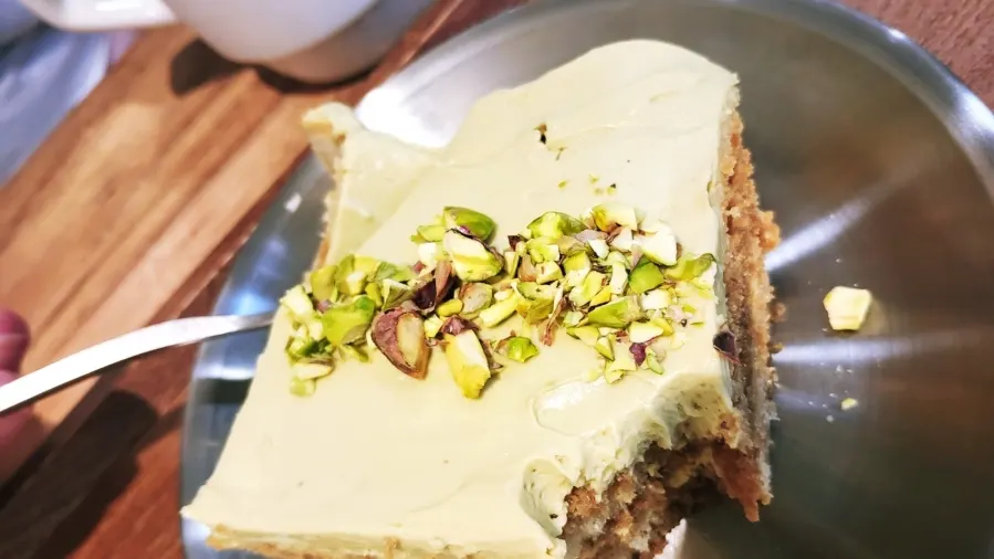 Chopped pistachio topping piled on the tiramisu