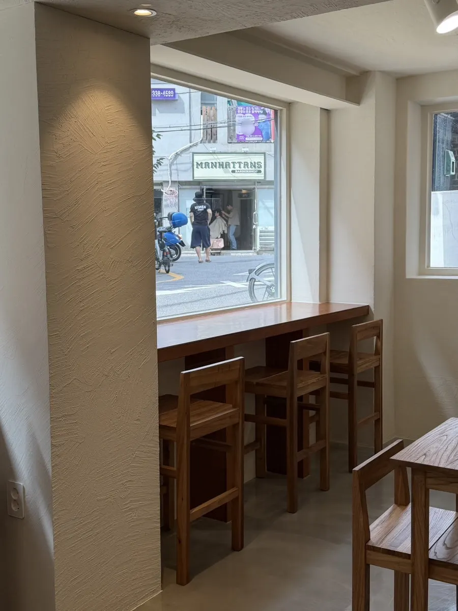 Long bar table with a view of Mangwon-dong