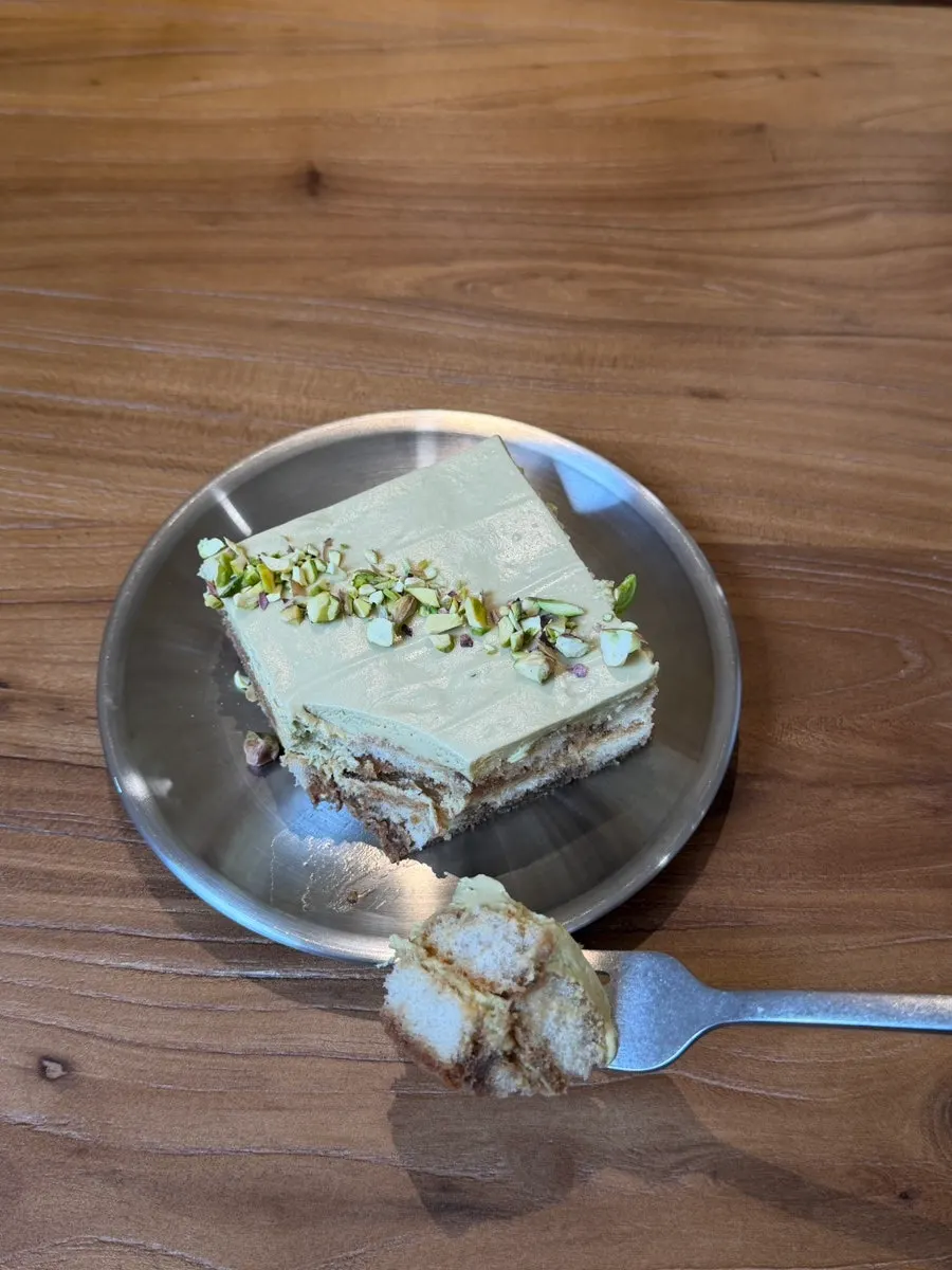 Close-up of tiramisu sprinkled with crushed pistachio