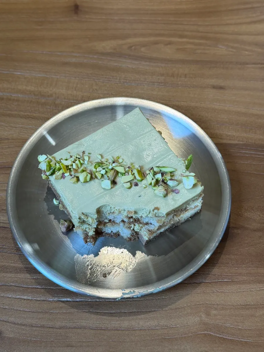Cross-section of the pistachio tiramisu showing the moist sponge