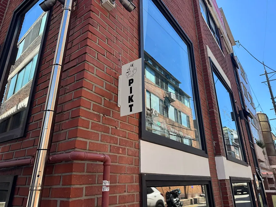 Exterior of PICT Roastery Mangwon Branch in a brick building