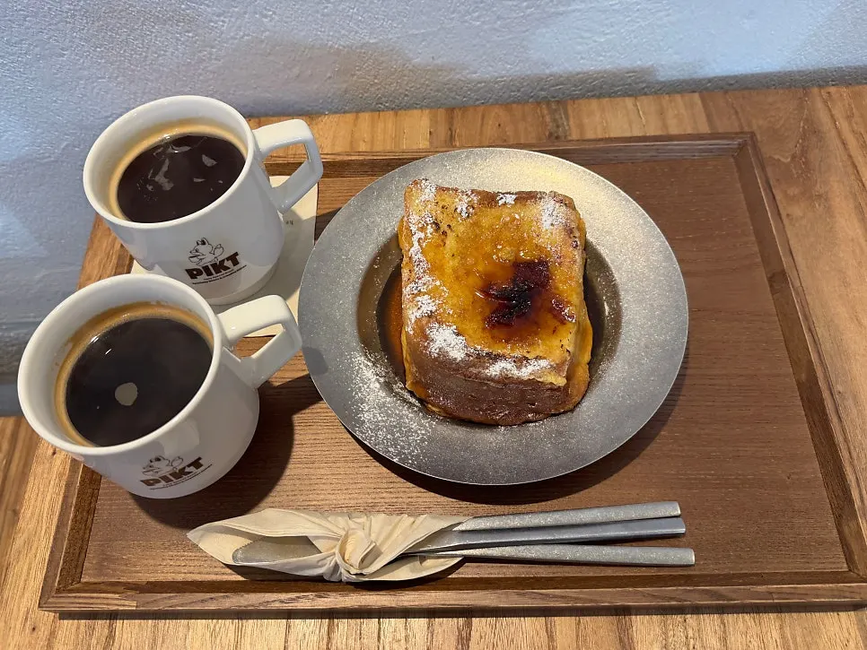 A piece of French toast cut with a fork