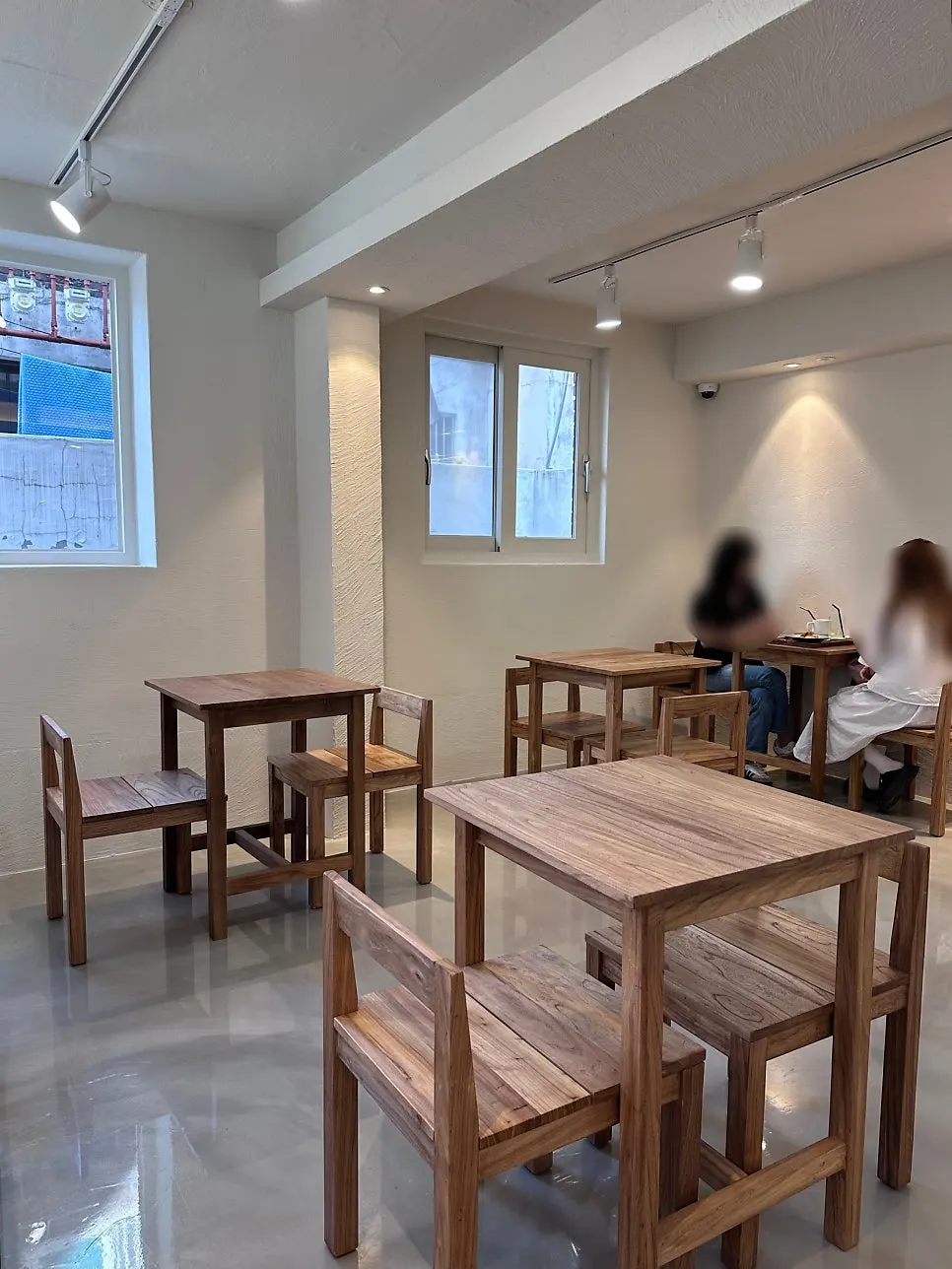 Seating with wood-tone tables and soft lighting