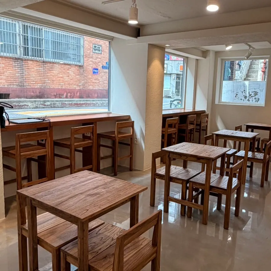 Café interior wrapped in large windows