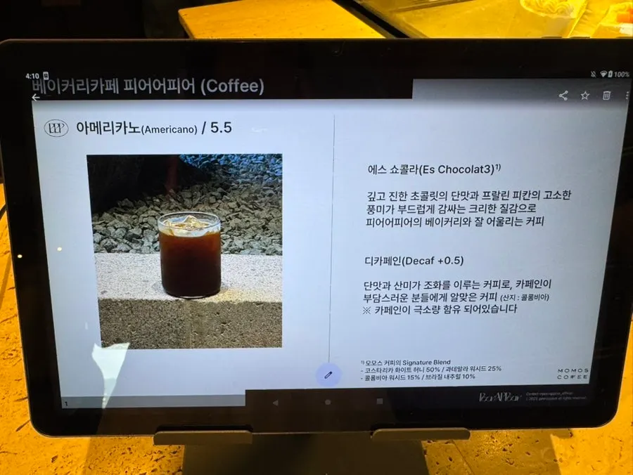 Peer a Peer's drink menu board featuring Momos Coffee beans