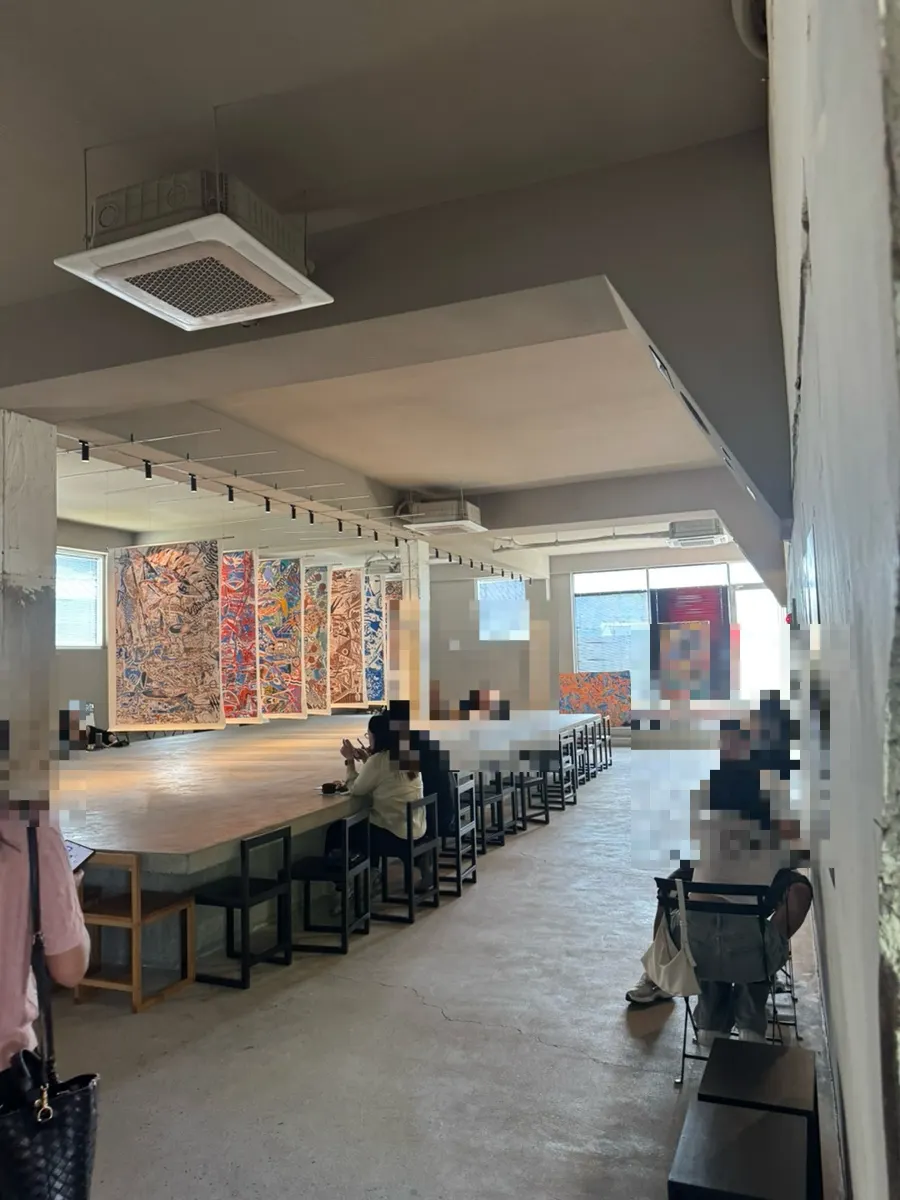 Spacious café interior seating inside the revived factory
