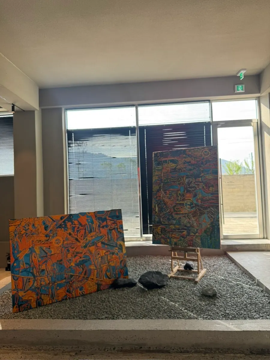 Large table seating in front of an art piece