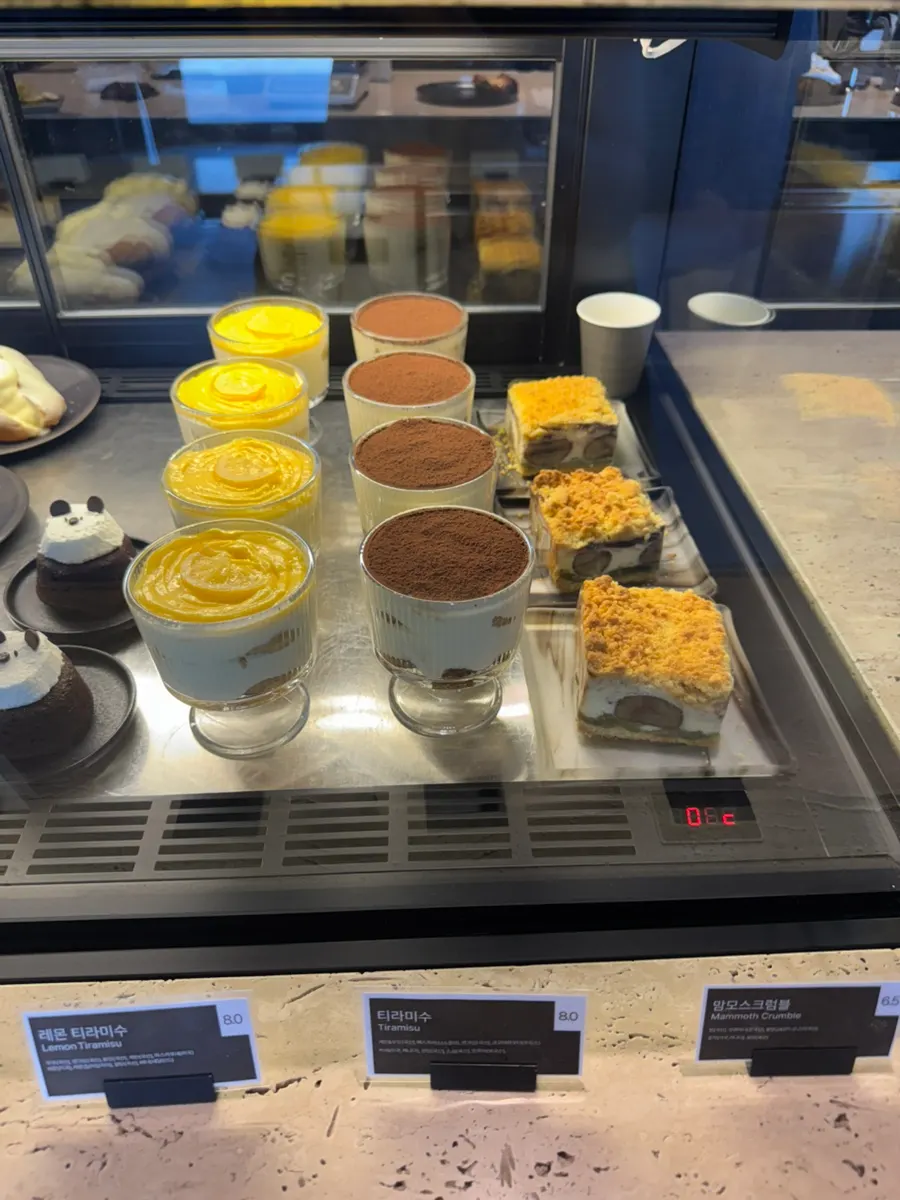 Display case of slice cakes and wakbbu salt bread