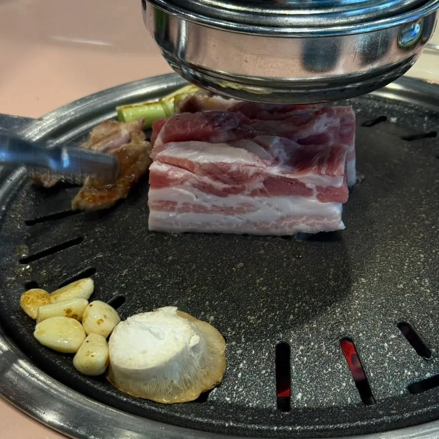 Pork neck and pork belly on the grill
