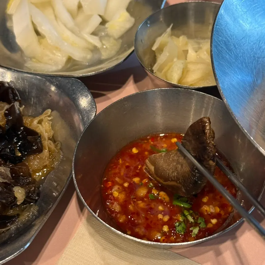 A bite of herring roe bibimbap wrapped in seaweed