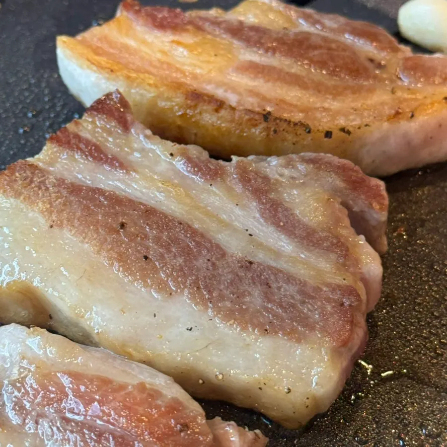 A juicy grilled piece of pork belly