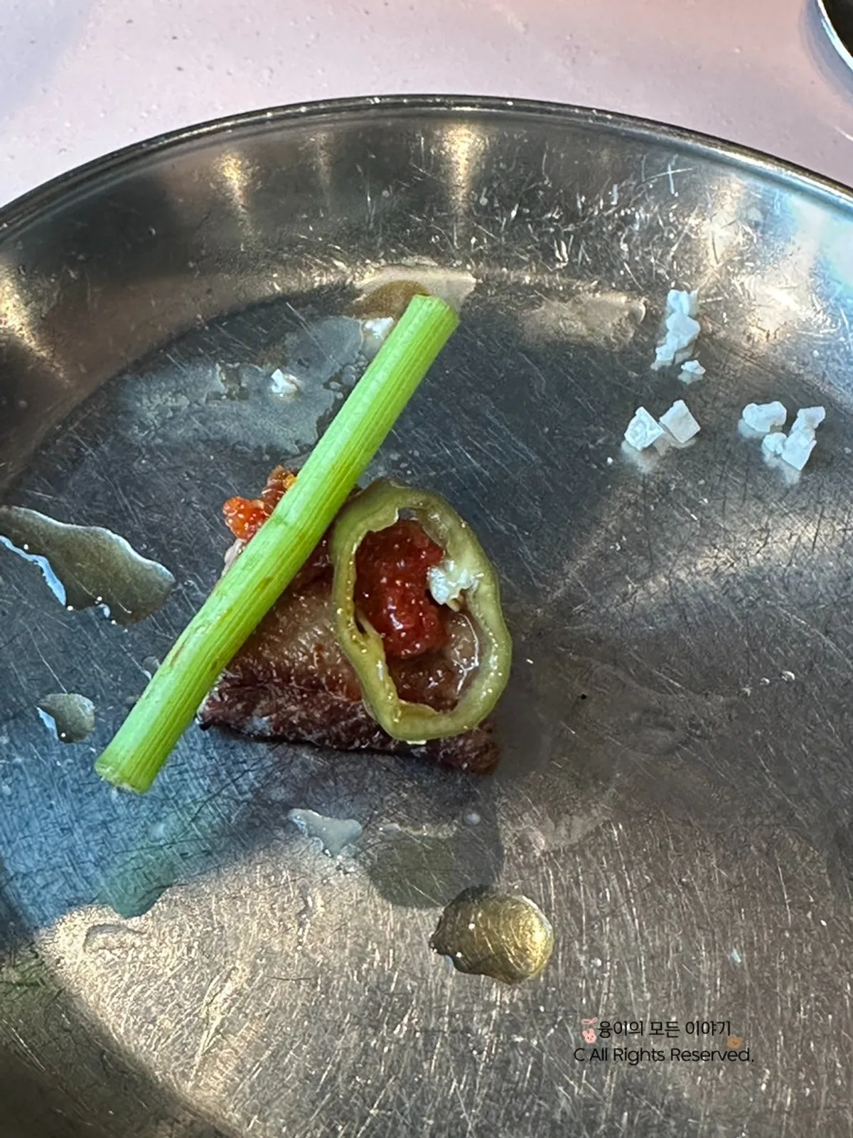 Holding a salted piece of pork neck