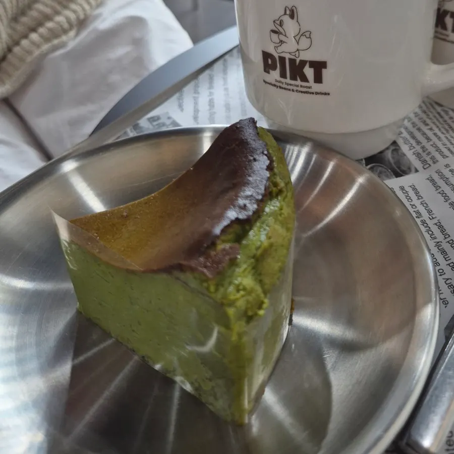 Matcha basque cheesecake served with coffee