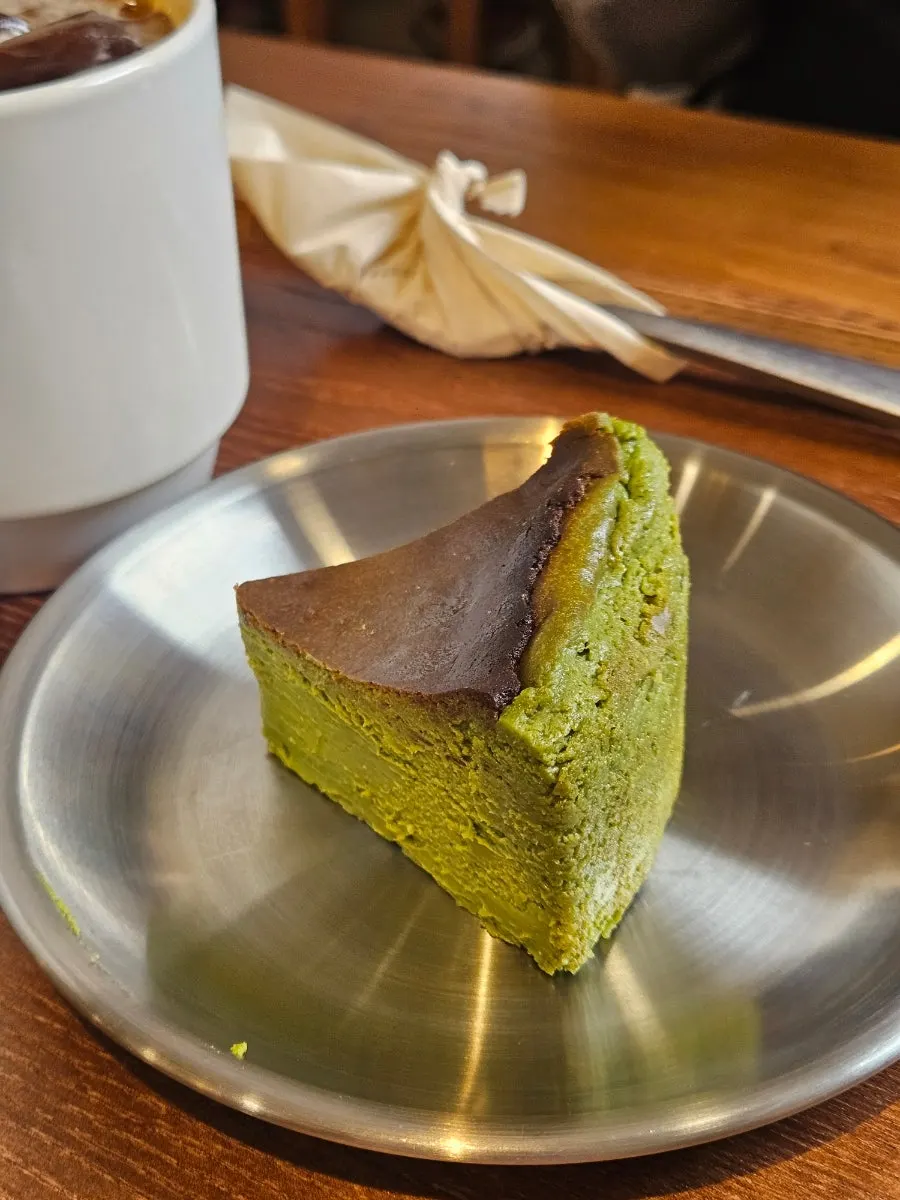 A slice of Kyoto matcha Basque cheesecake