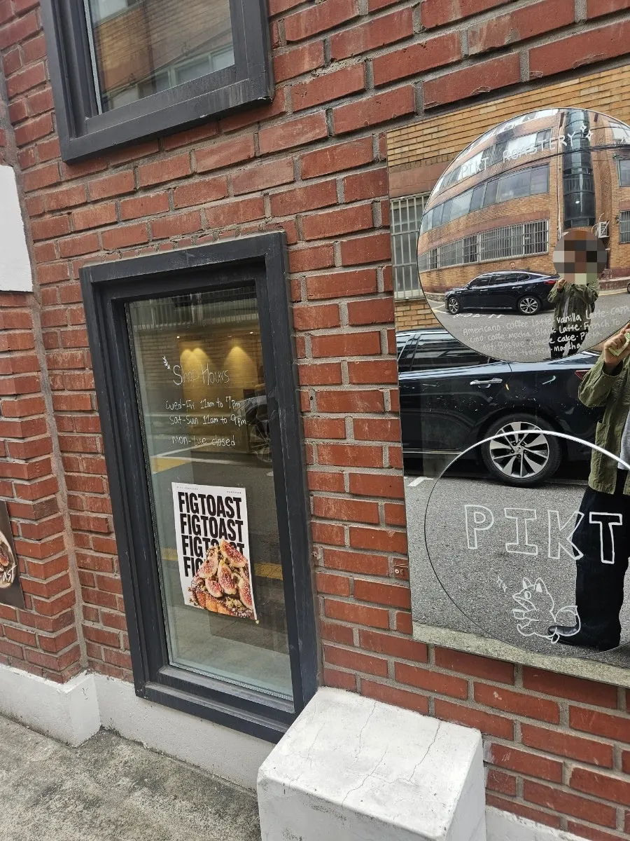 Alley leading around the right side of the building to the café entrance