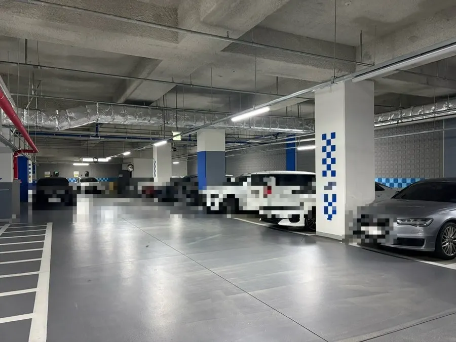 Parking lot at the building housing Filling Donkatsu Cheomdan Direct Store