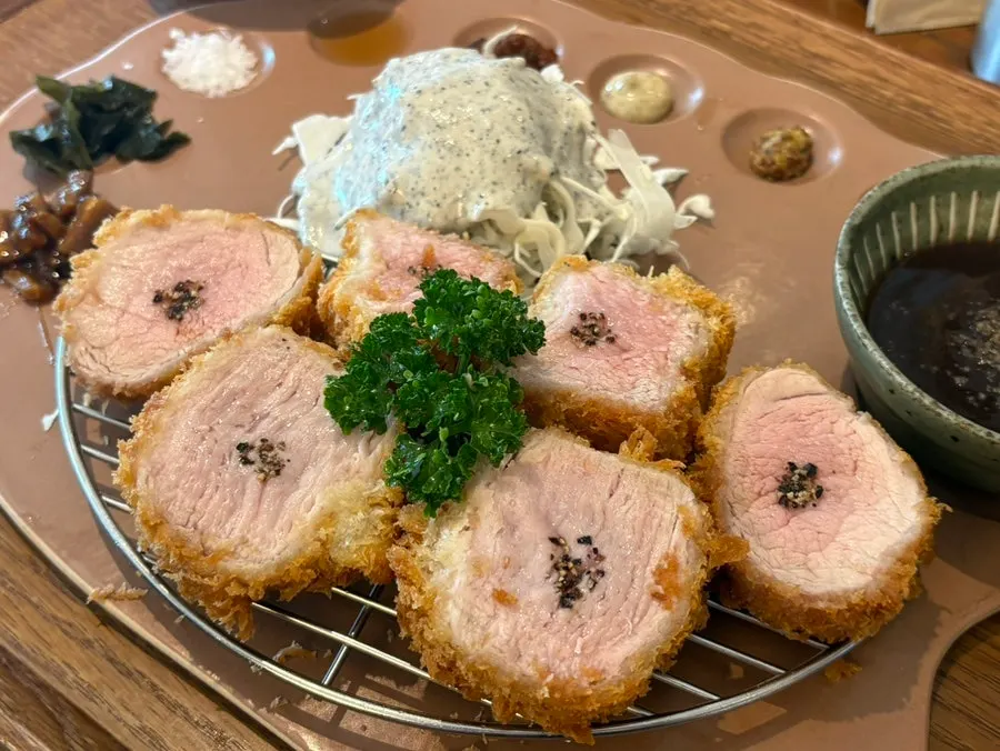 Cross-section of tenderloin katsu showing its juices