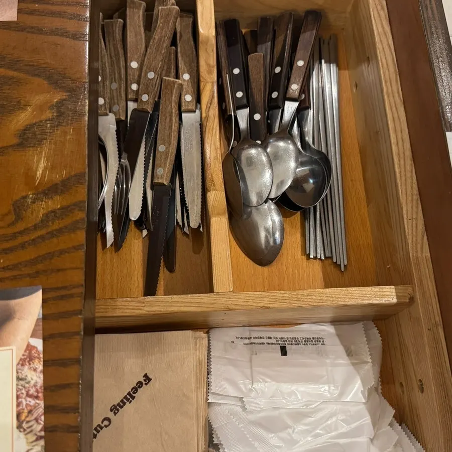 Table at Filling Donkatsu with utensils and a kiosk