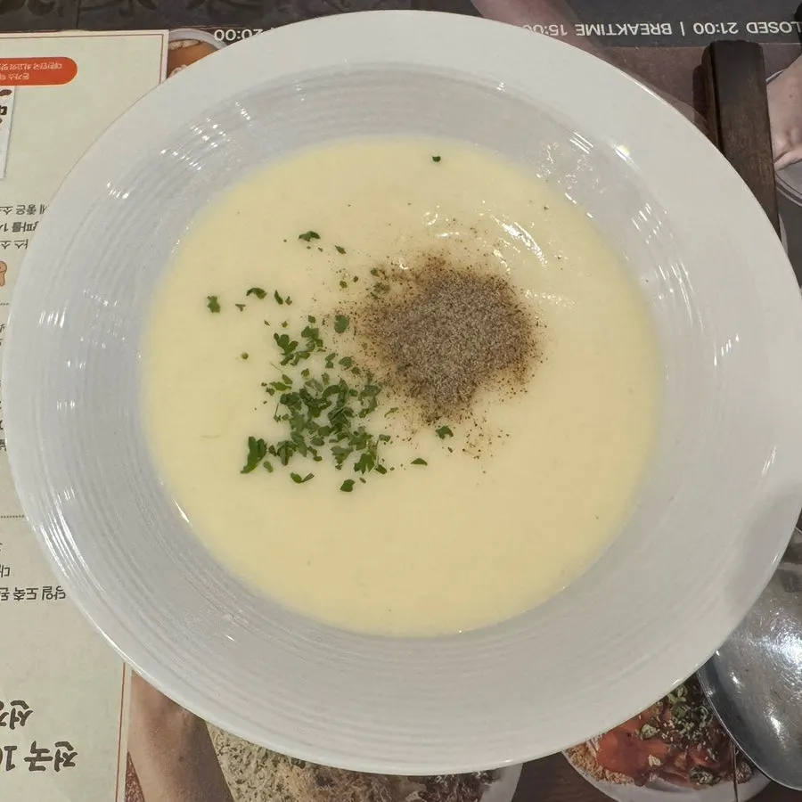 The warm soup served first at the start of the meal