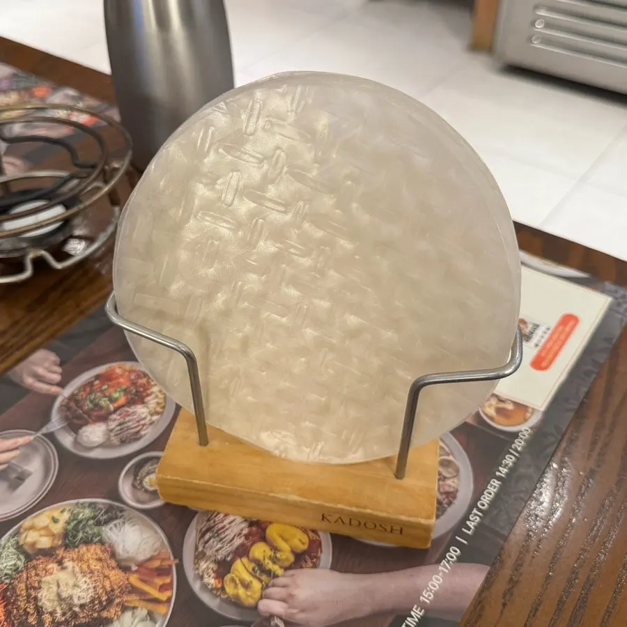 Rice paper and warm water served alongside the wrapped katsu