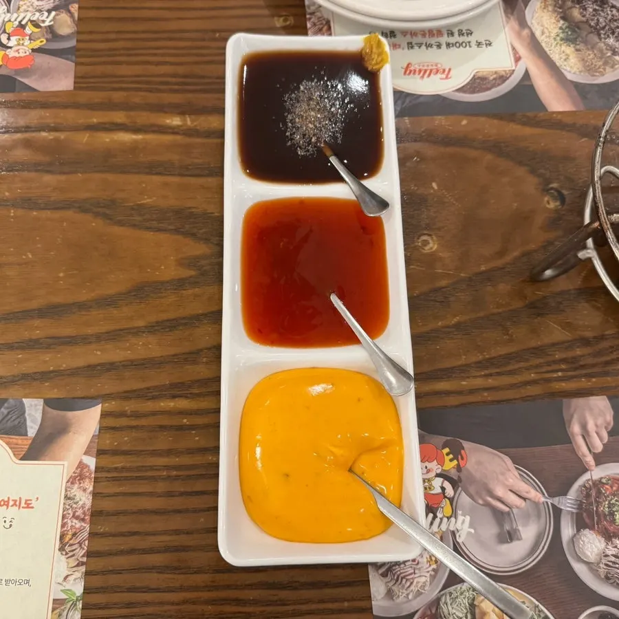 An assortment of sauces to go with the wrapped katsu