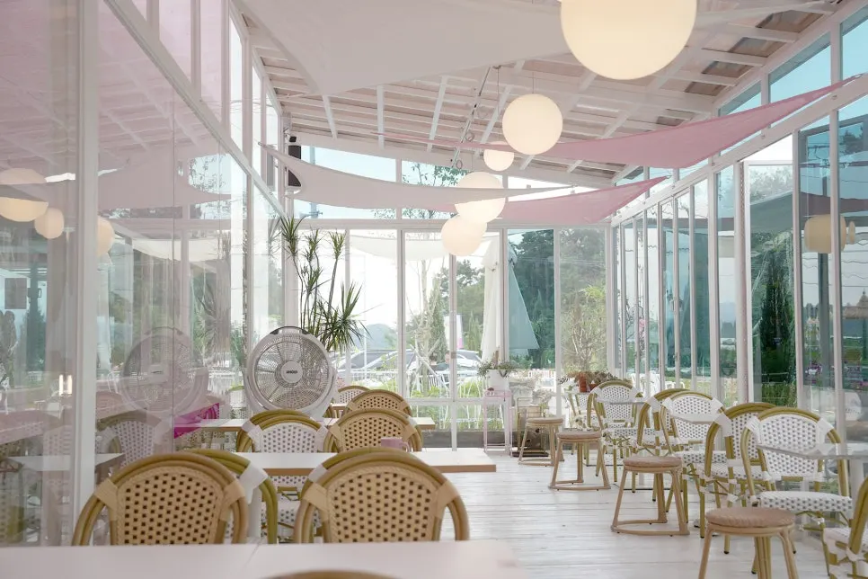 Half-indoor half-outdoor terrace at Pink Wall Cafe