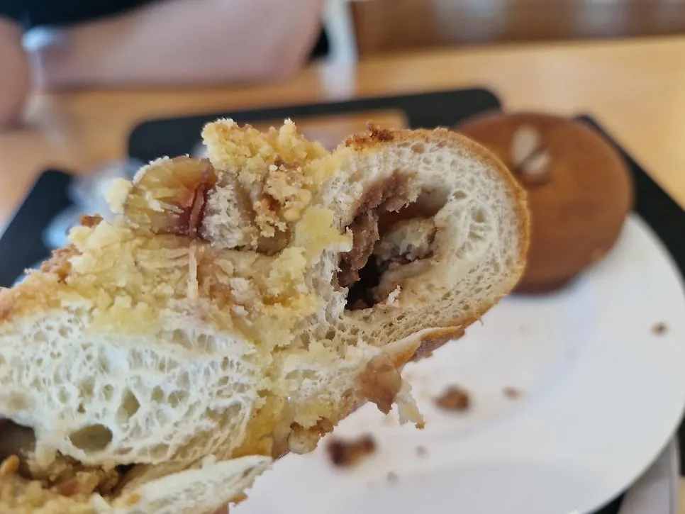 A bite of bagel with cream cheese