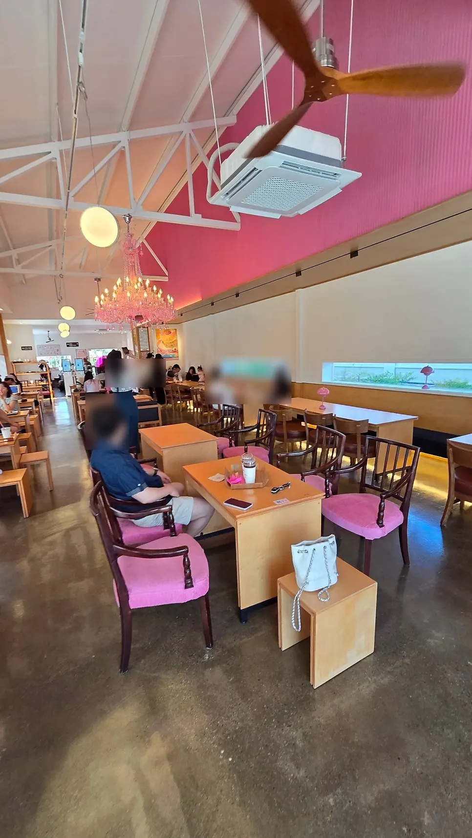 Interior of Pink Wall Cafe decorated in pink tones