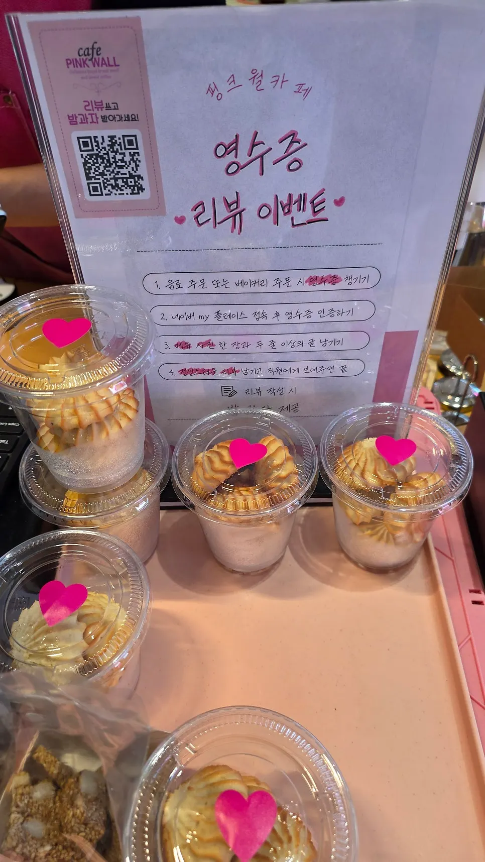 Sign for the receipt review event at Pink Wall Cafe