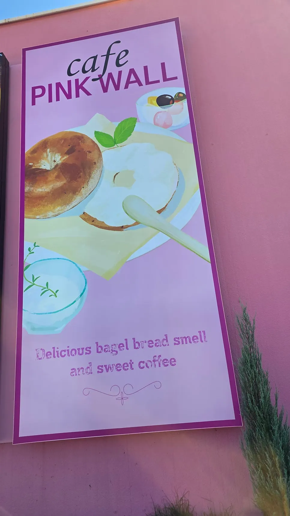 Drinks and desserts on the table at Pink Wall Cafe