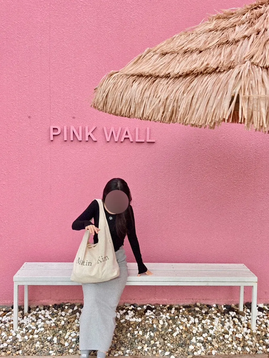 Indoor terrace seating at Pink Wall Cafe