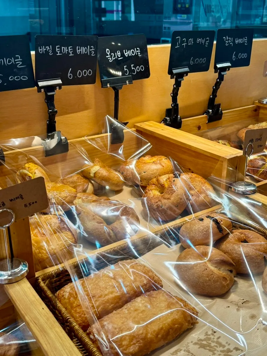 Various bagel types on display at Pink Wall Cafe