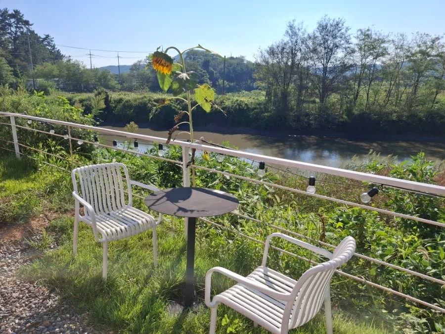 View of the outdoor terrace seating at Pink Wall Cafe