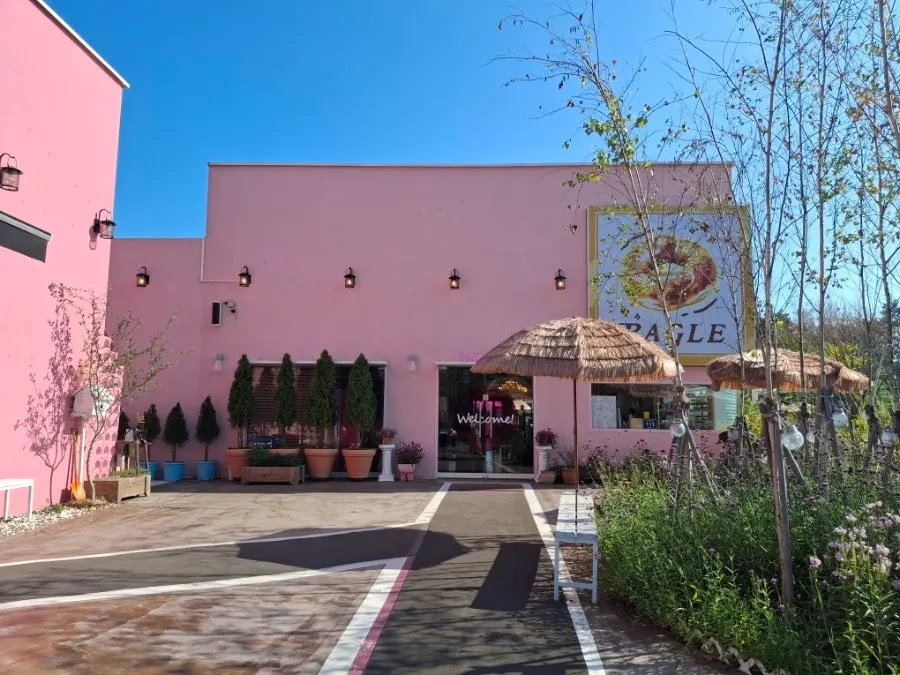 View of Pink Wall Cafe's parking lot and entrance
