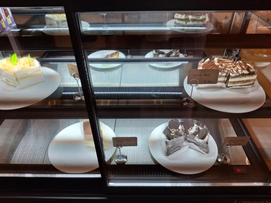 Cake display case at Pink Wall Cafe