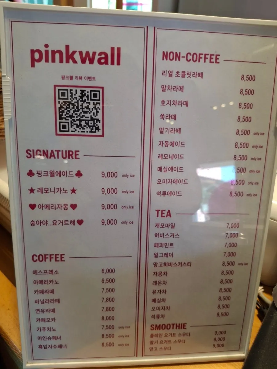 Drink menu board at Pink Wall Cafe