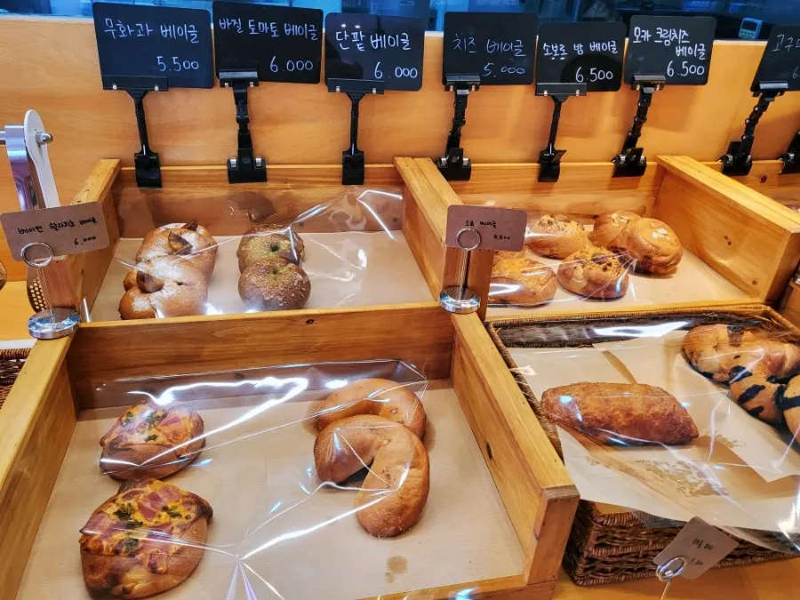 Garlic bagel and cream cheese at Pink Wall Cafe