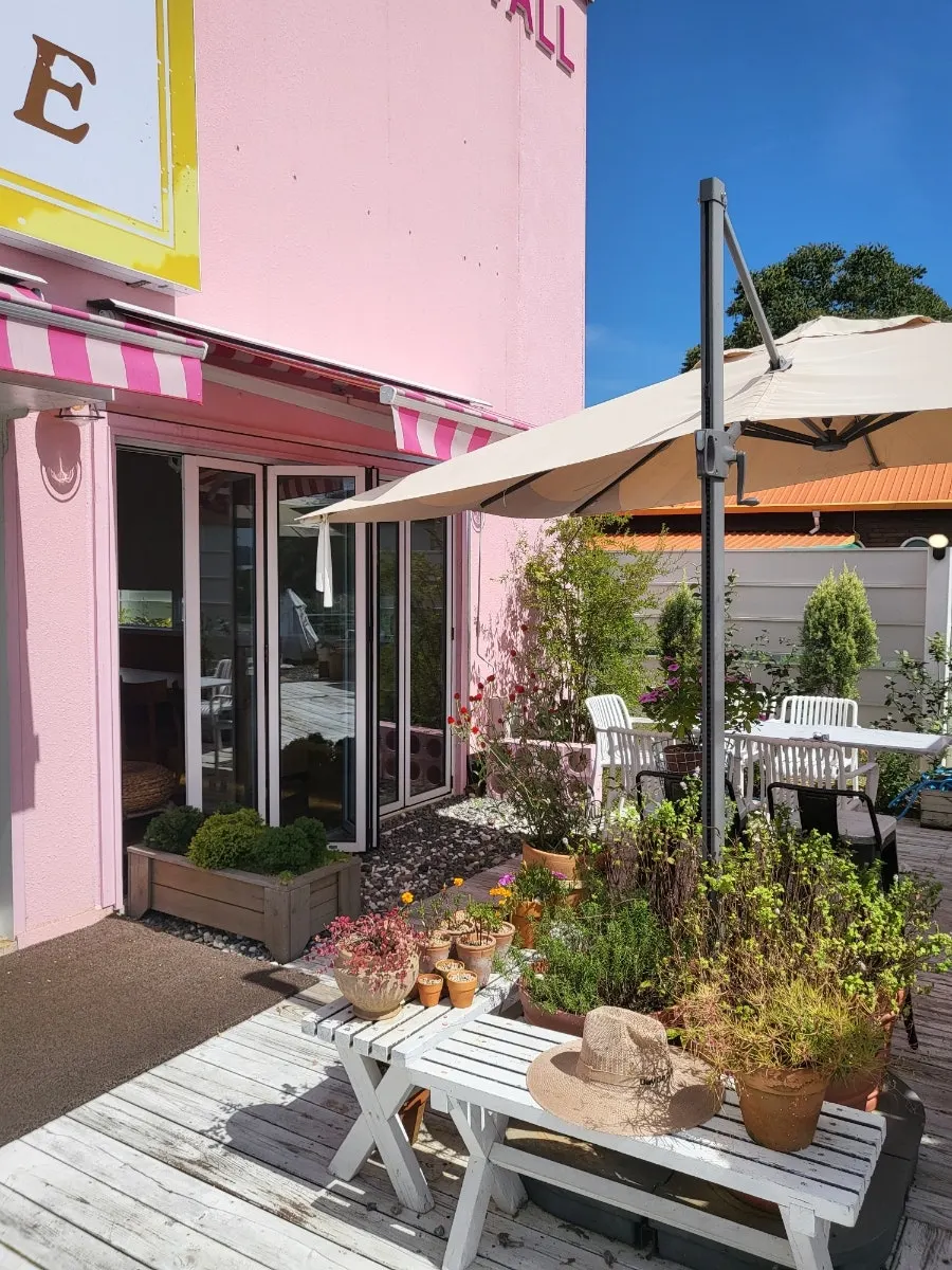 Entrance and lovely pink outer wall of Pink Wall Cafe
