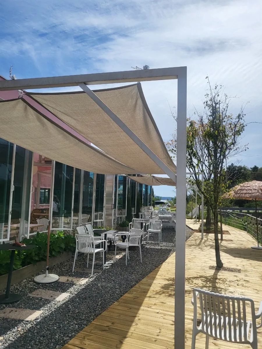 Café garden in bloom under an autumn sky