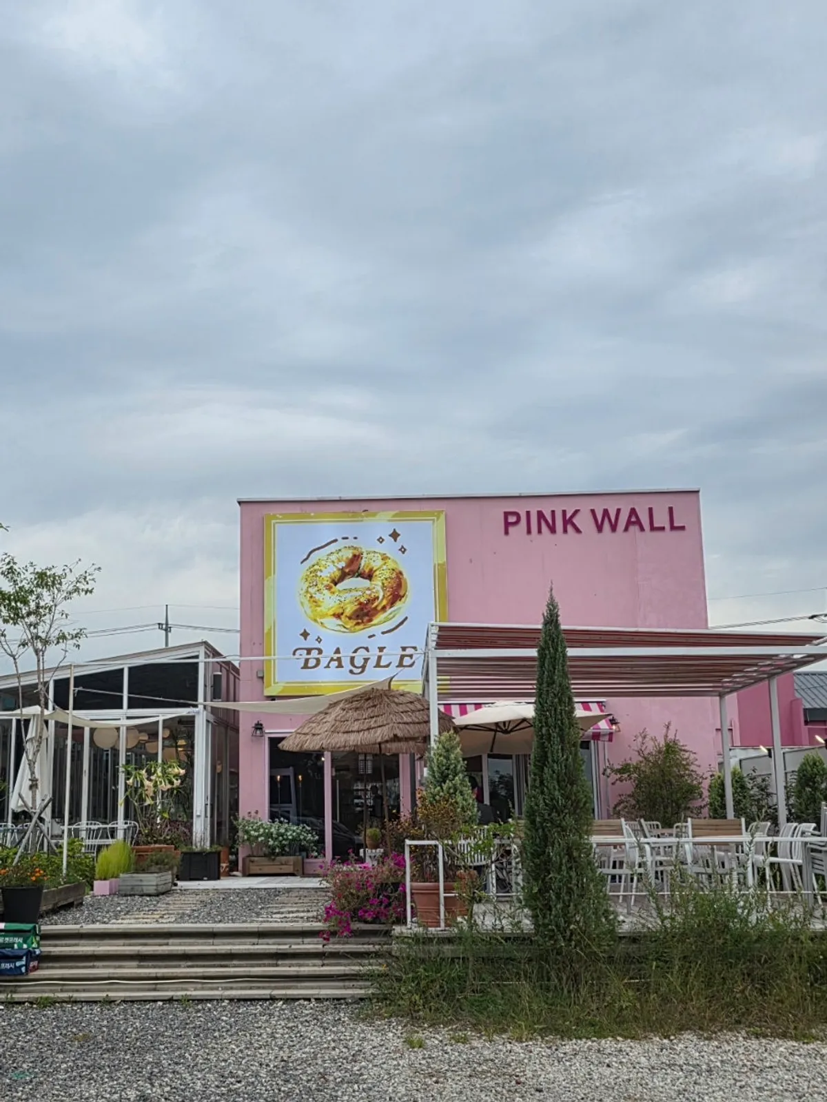 Pink exterior and entrance of Pink Wall Cafe in Yeongjong