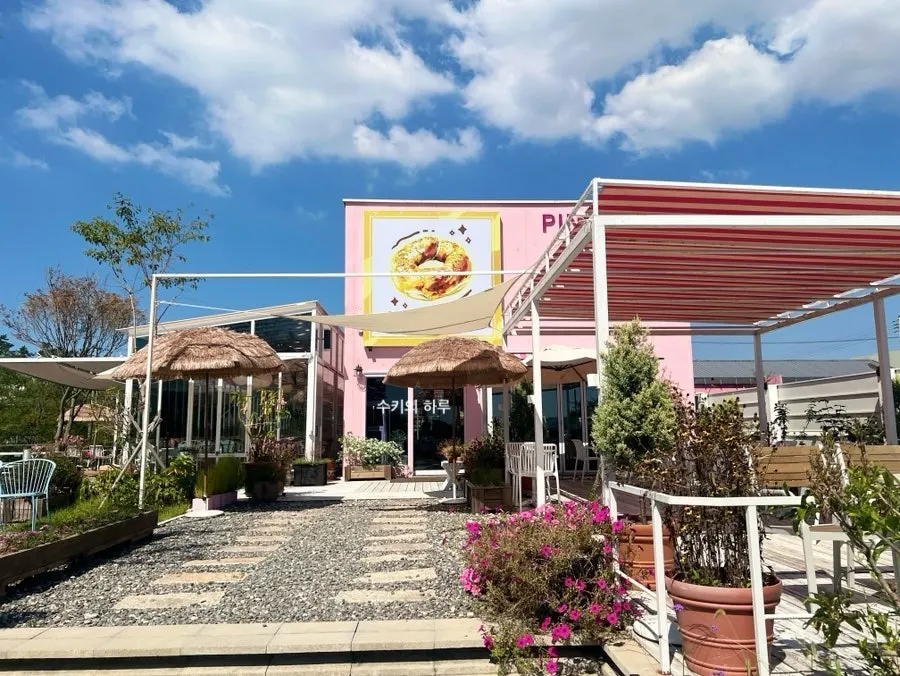 Light pink exterior building of Pink Wall Cafe
