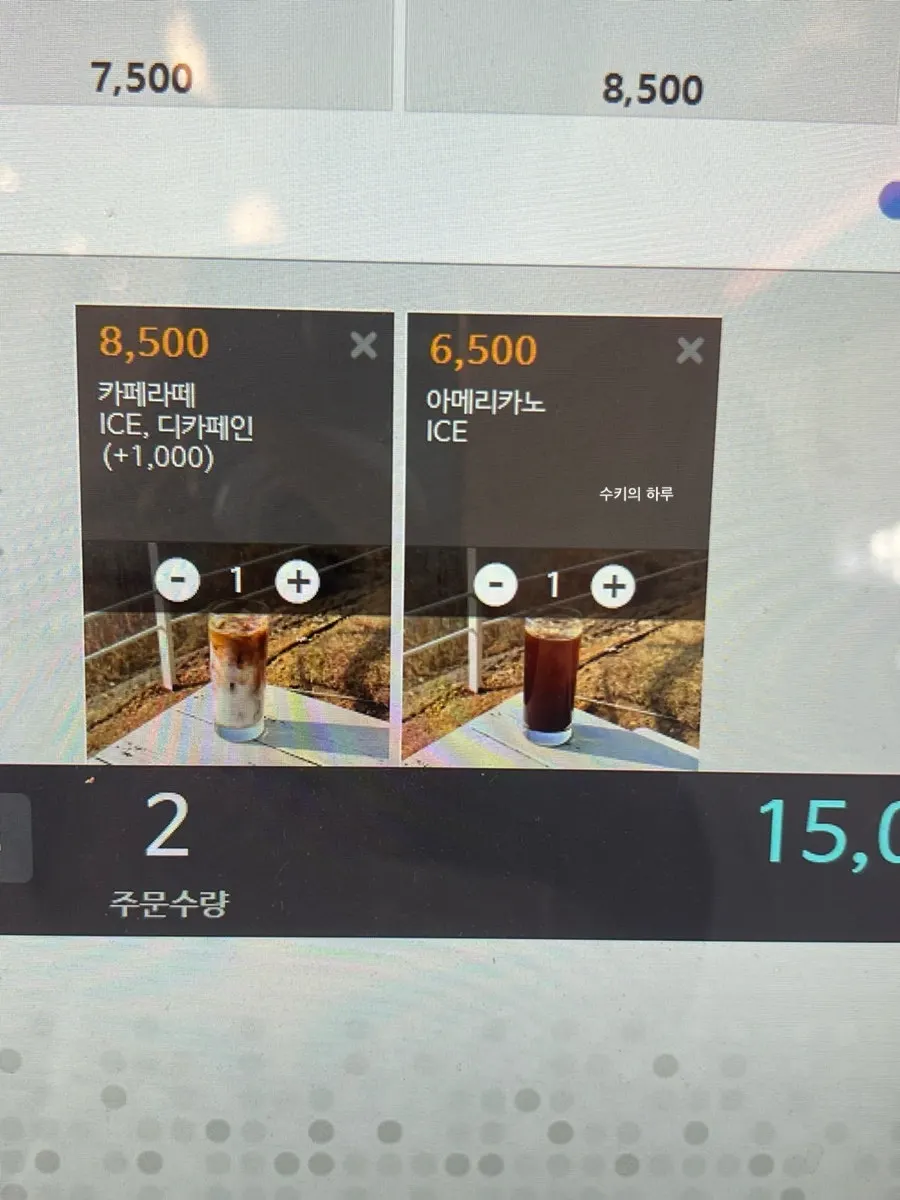Two iced drinks, an americano and a caffè latte